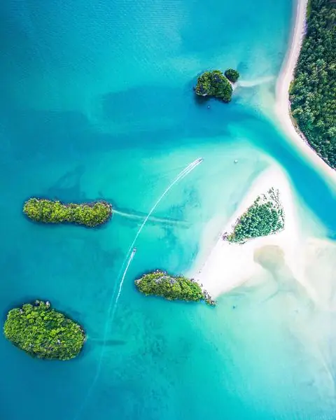 Aerial view of a turquoise atoll and white sandbank